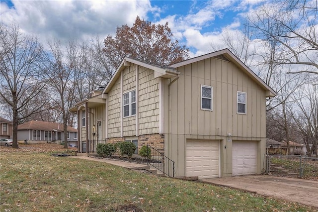 view of property exterior featuring a yard and a garage