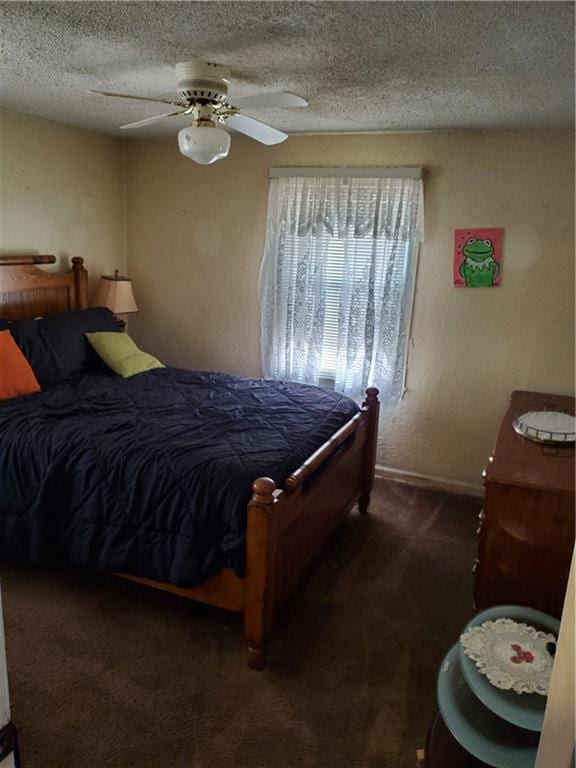 carpeted bedroom featuring a textured ceiling and ceiling fan