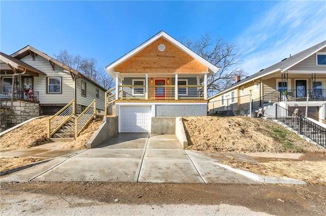 view of front of property featuring a porch and a garage