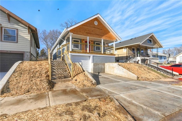 view of front of house featuring a balcony and a garage