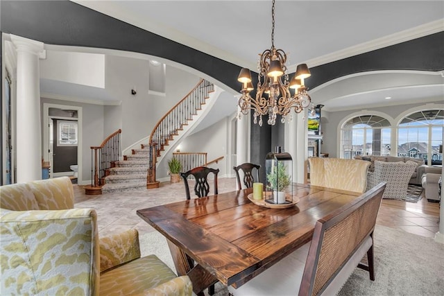 dining area featuring crown molding, light tile patterned floors, and a notable chandelier