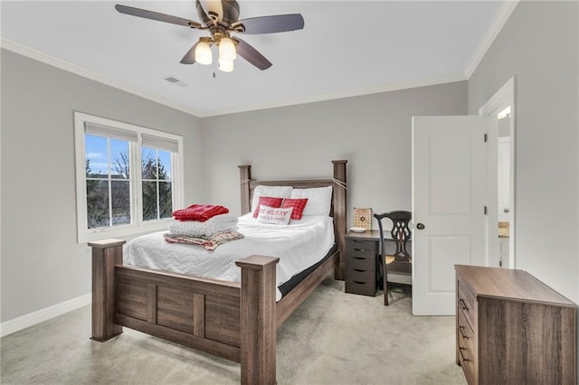 carpeted bedroom with ceiling fan and crown molding