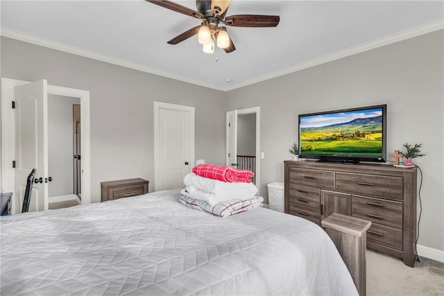 carpeted bedroom with ceiling fan and crown molding