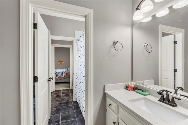 bathroom featuring tile patterned flooring and vanity