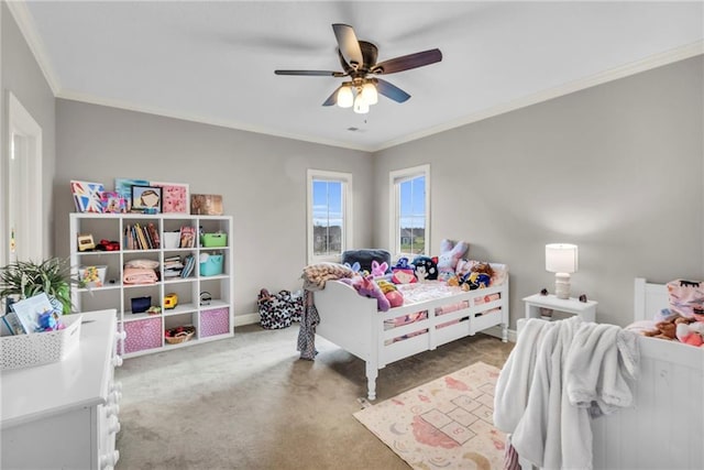 bedroom featuring carpet, ceiling fan, and ornamental molding