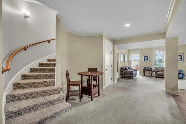 interior space featuring carpet floors and crown molding