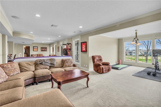 living room featuring a chandelier, crown molding, and light carpet