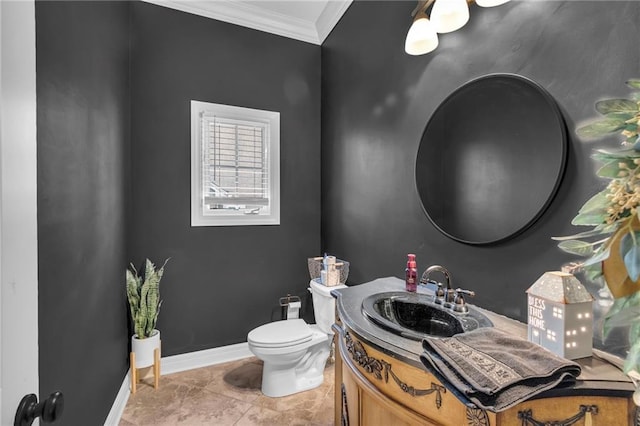 bathroom featuring tile patterned floors, vanity, toilet, and crown molding