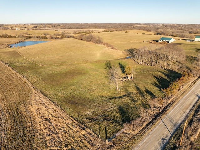 aerial view featuring a water view and a rural view