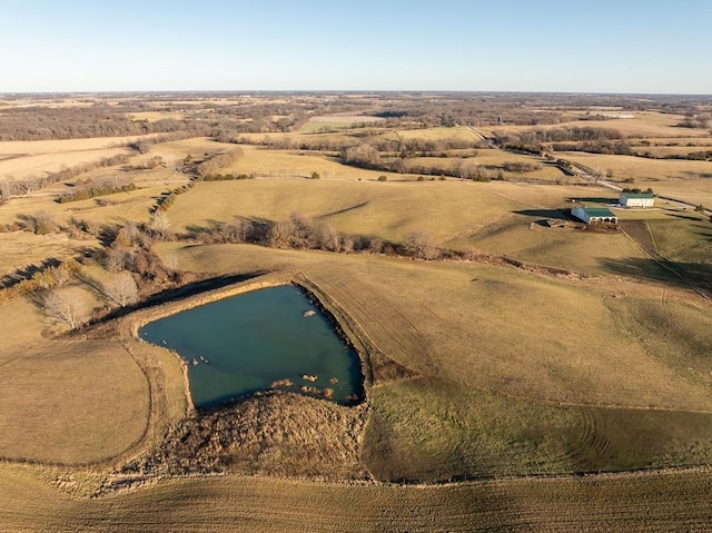 aerial view featuring a rural view and a water view