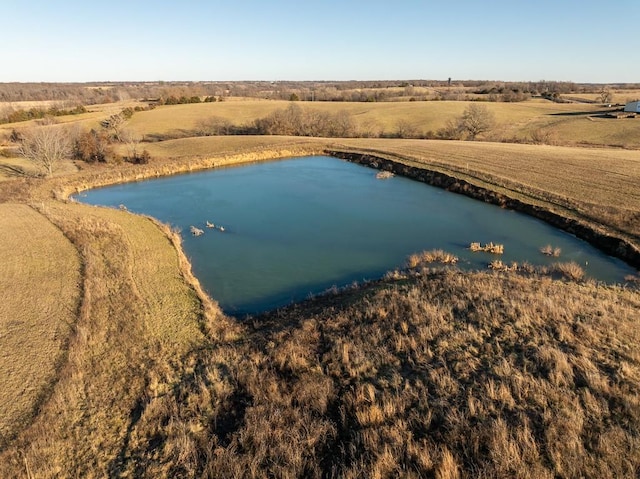 drone / aerial view featuring a rural view and a water view