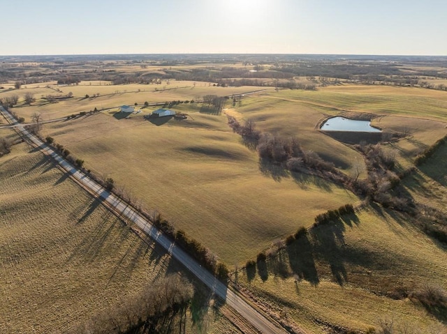 aerial view featuring a rural view and a water view