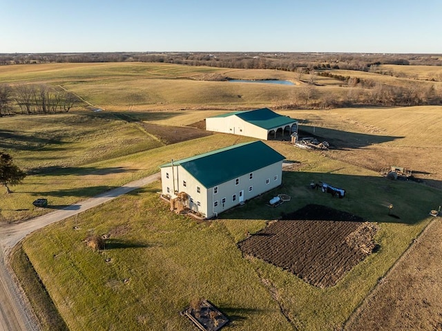 birds eye view of property featuring a rural view