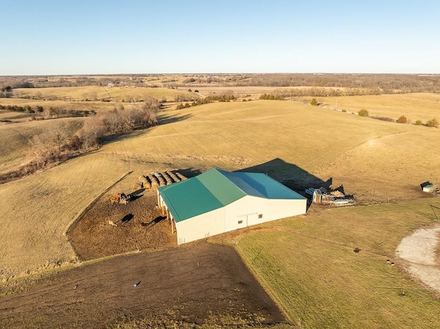 birds eye view of property with a rural view