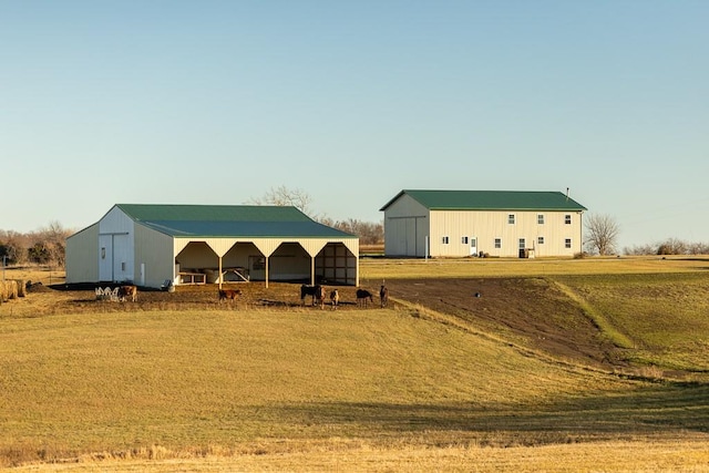 view of horse barn featuring a rural view