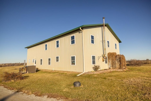 view of side of property with a yard