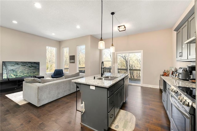 kitchen featuring gray cabinets, light stone countertops, sink, and stainless steel appliances