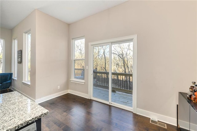 entryway with dark hardwood / wood-style floors