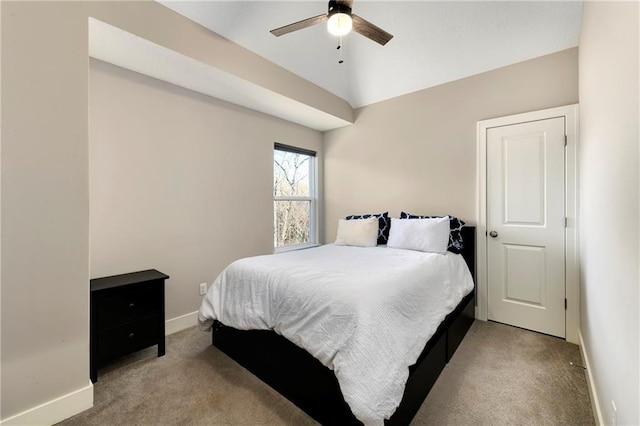 carpeted bedroom featuring vaulted ceiling and ceiling fan