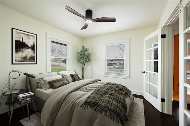 4412 N Jackson Ave, Kansas City, MO 64117 - bedroom with ceiling fan and dark wood-type flooring