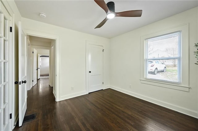 4412 N Jackson Ave, Kansas City, MO 64117 - unfurnished bedroom featuring a closet, ceiling fan, and dark hardwood / wood-style flooring