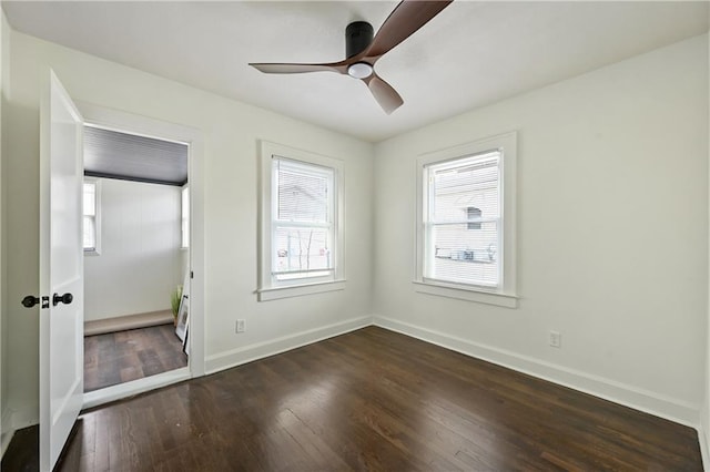 4412 N Jackson Ave, Kansas City, MO 64117 - unfurnished bedroom with dark hardwood / wood-style flooring and ceiling fan