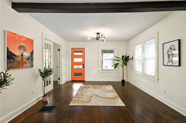 4412 N Jackson Ave, Kansas City, MO 64117 - entrance foyer with beamed ceiling, dark hardwood / wood-style floors, french doors, and a chandelier