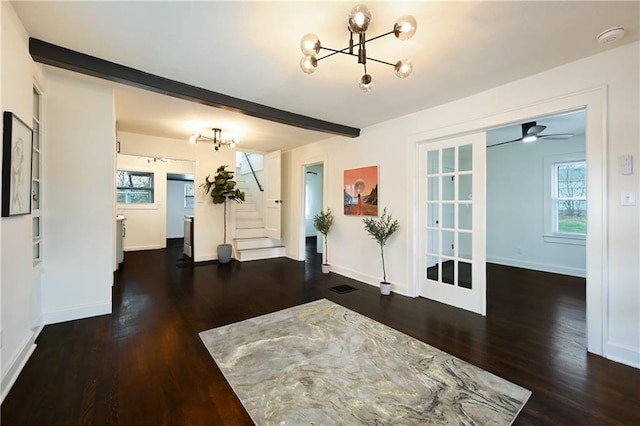 4412 N Jackson Ave, Kansas City, MO 64117 - entryway with beam ceiling, french doors, dark wood-type flooring, and ceiling fan with notable chandelier