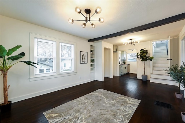 4412 N Jackson Ave, Kansas City, MO 64117 - interior space featuring a chandelier and dark hardwood / wood-style flooring