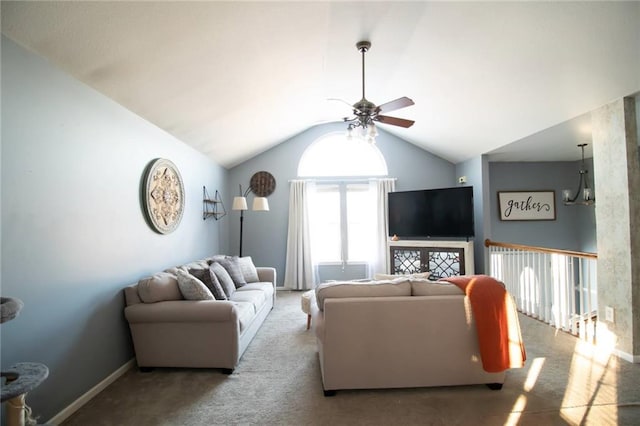 living room with ceiling fan, lofted ceiling, and carpet flooring