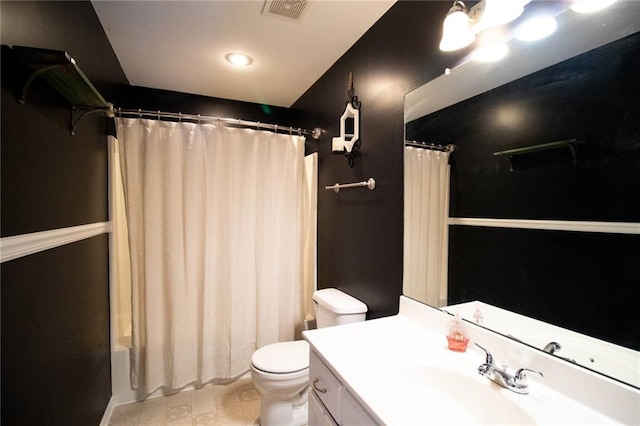 full bathroom with toilet, vanity, and shower / bath combo with shower curtain