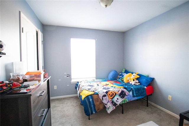 bedroom with light colored carpet