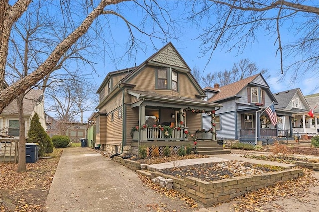 victorian house featuring covered porch