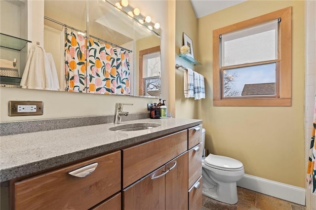 bathroom with tile patterned flooring, vanity, toilet, and a shower with curtain