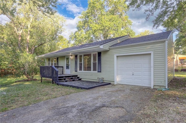 ranch-style home with covered porch, a garage, and a front lawn