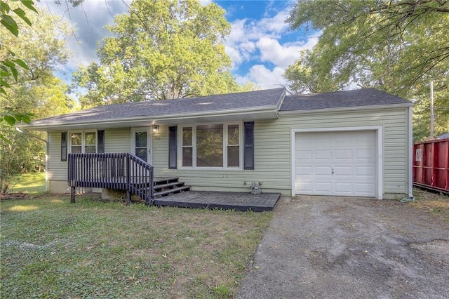 single story home featuring a front yard, a porch, and a garage