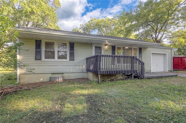 ranch-style home with a garage and a front lawn