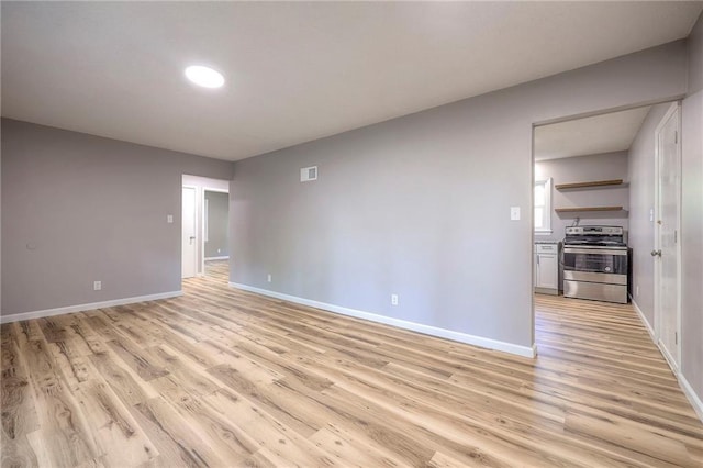 unfurnished room featuring light hardwood / wood-style flooring