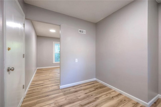 spare room featuring light hardwood / wood-style flooring