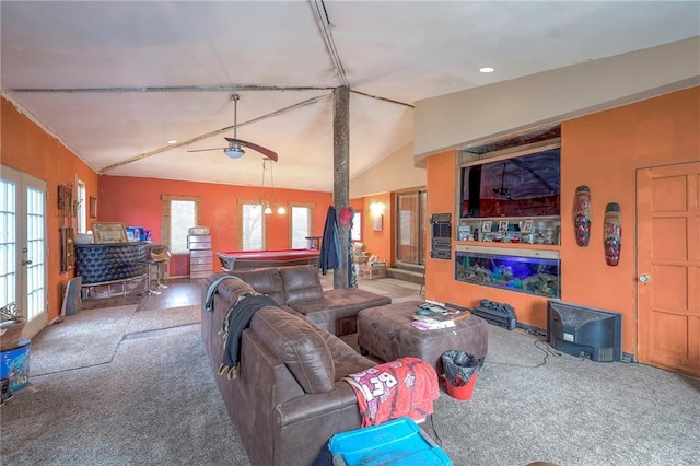 carpeted living room featuring ceiling fan and vaulted ceiling