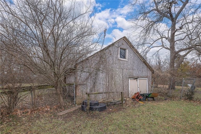 exterior space with a storage shed and a yard