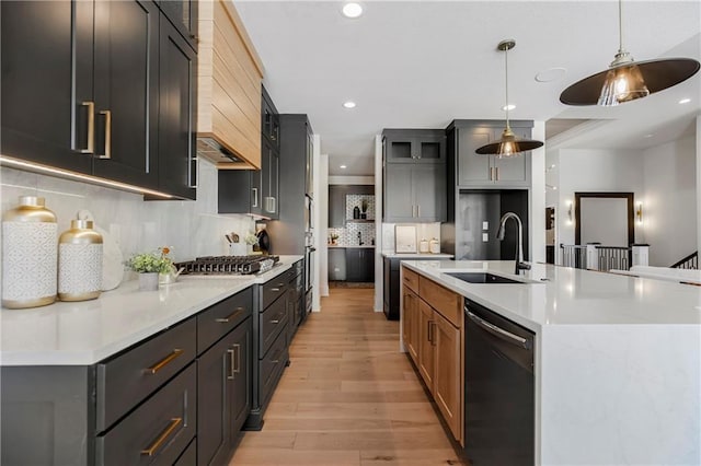 16781 S Fellows St, Olathe, KS 66062 - kitchen featuring dishwasher, stainless steel gas cooktop, light wood finished floors, custom exhaust hood, and recessed lighting