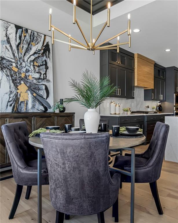 16781 S Fellows St, Olathe, KS 66062 - dining space with a chandelier, recessed lighting, and light wood-style flooring