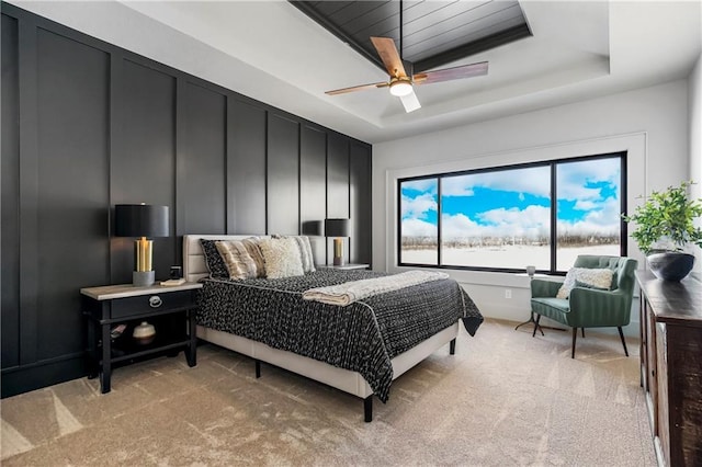 16781 S Fellows St, Olathe, KS 66062 - bedroom with light carpet, a water view, a raised ceiling, and a ceiling fan