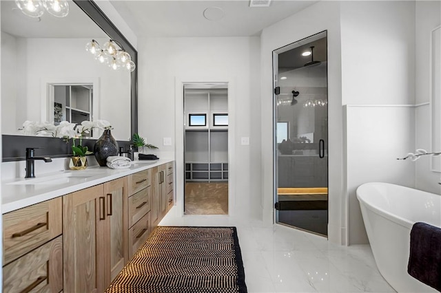 16781 S Fellows St, Olathe, KS 66062 - full bathroom with a stall shower, double vanity, marble finish floors, and a soaking tub