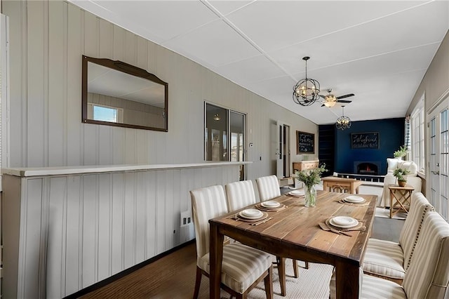 dining room featuring dark hardwood / wood-style floors and a notable chandelier