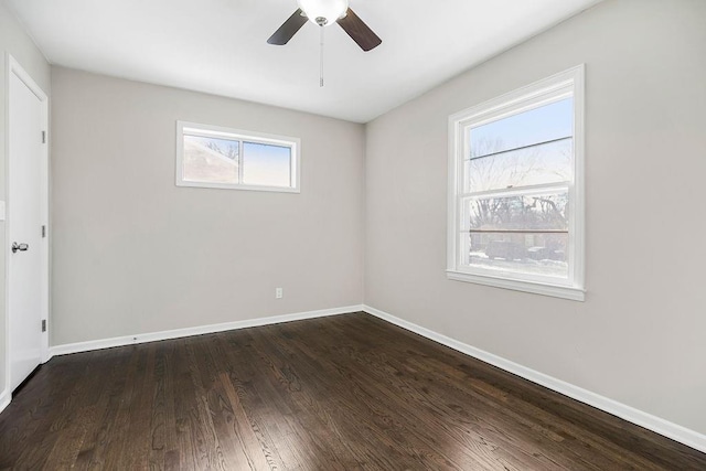 unfurnished room with dark hardwood / wood-style floors and ceiling fan