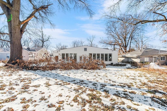 view of snow covered house