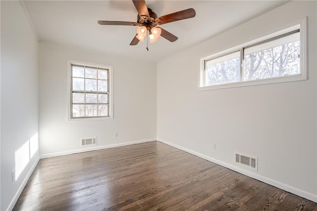 spare room with ceiling fan, dark hardwood / wood-style floors, and ornamental molding