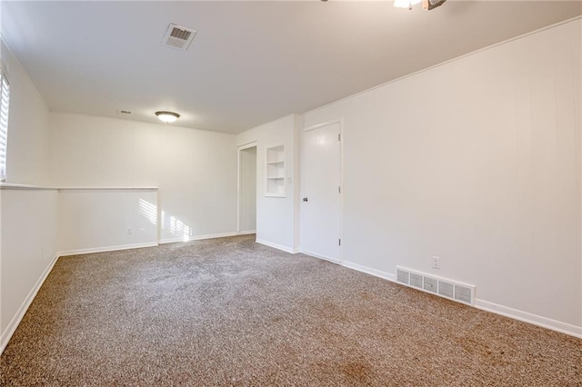 spare room featuring carpet